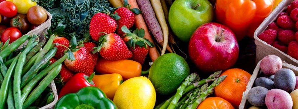 Assorted produce green beans, strawberries, apples, asparagus, bell peppers 